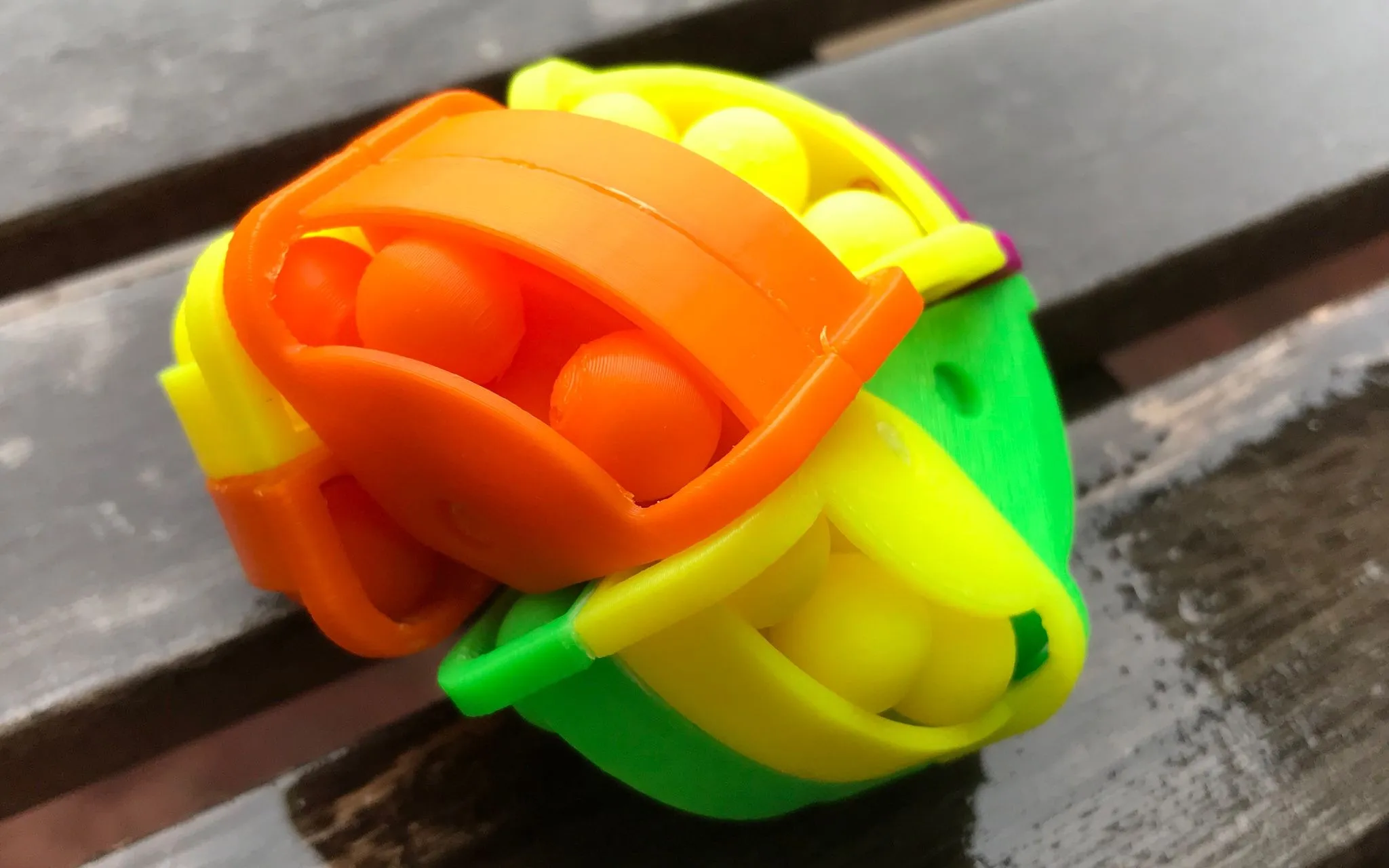 Close view of an ASTROLABACUS puzzle showing the printed tunnels and balls